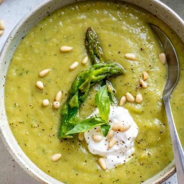 top view of spoon in asparagus soup