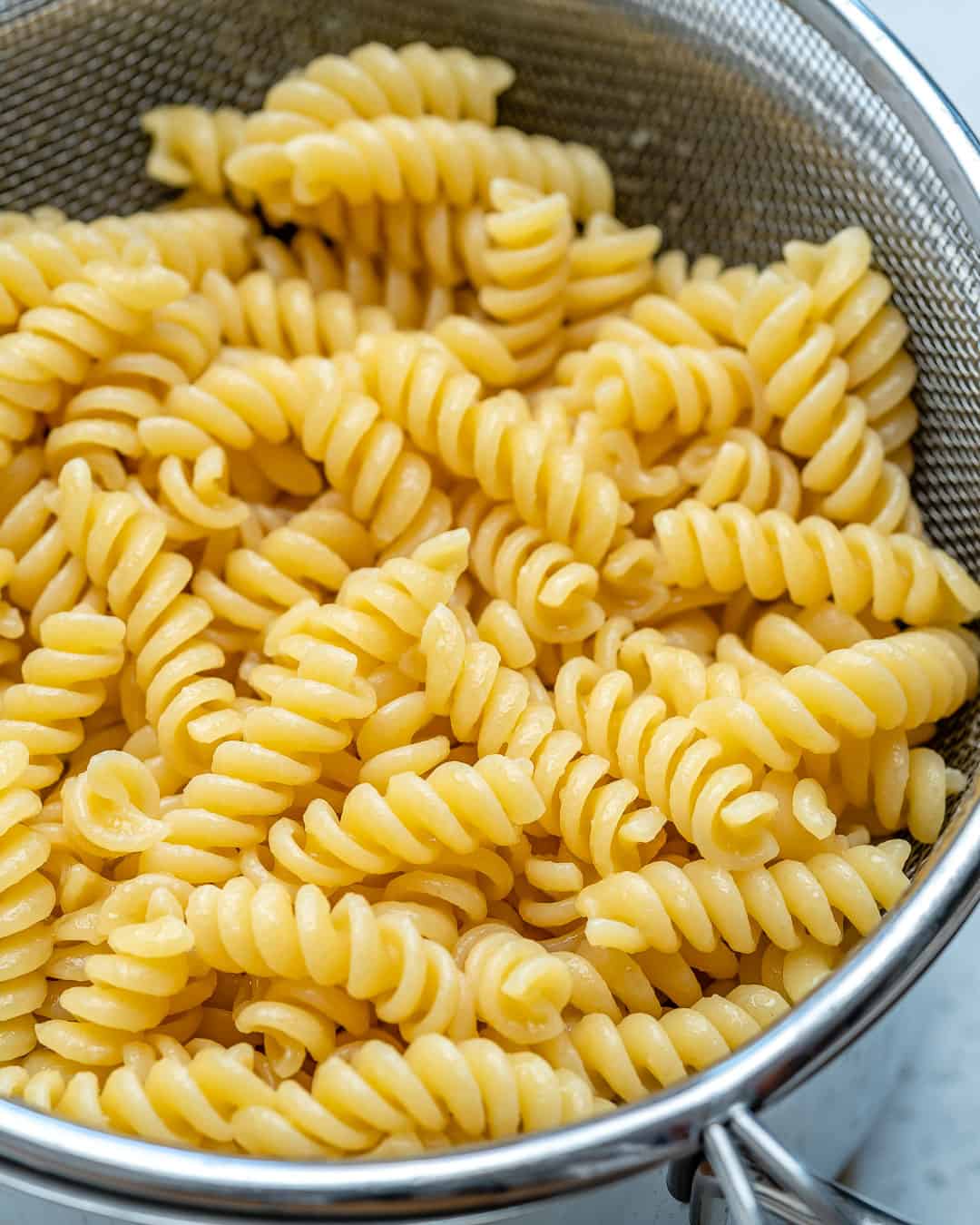 cooked pasta in colander to use for pasta salad.