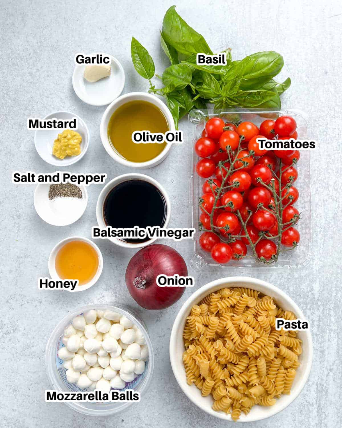 ingredients laid out to make Caprese pasta salad.