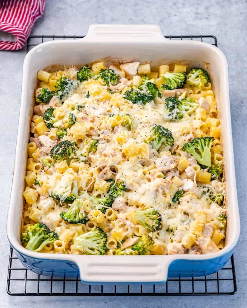Chicken Alfredo bake in a casserole dish on a wire rack.