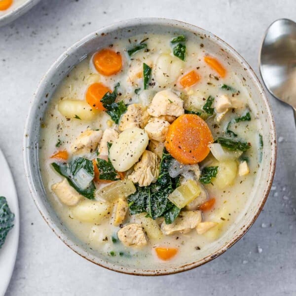 top view of creamy chicken soup in a white bowl