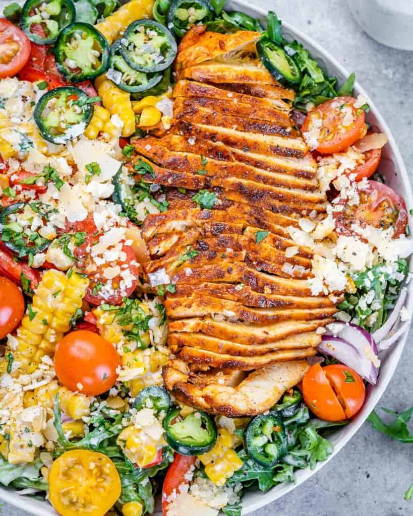 close up chicken arugula salad 