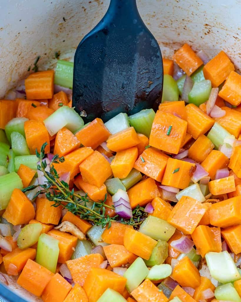 Vegetables added into a pot.