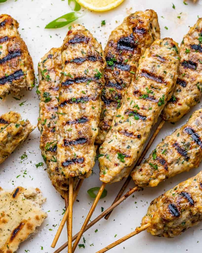 top view chicken kafta skewers on a platter 