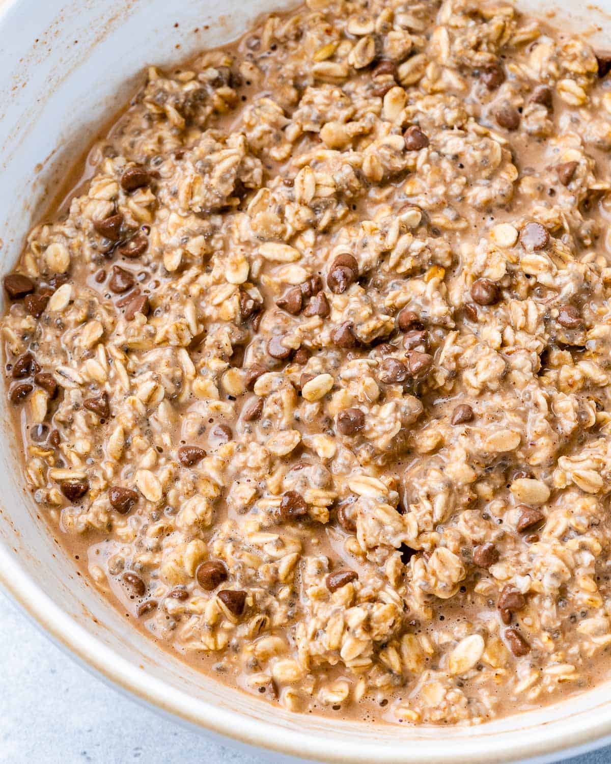 Overnight oats mixed in a large white bowl.