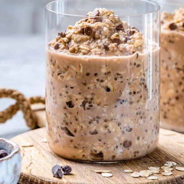 overnight oats in a jar on a wooden surface.