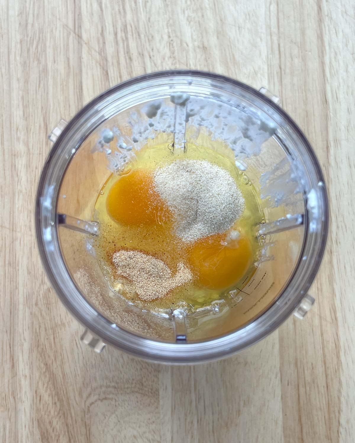 cottage cheese, eggs, and seasonings are added to a blender cup.