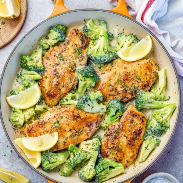 top view chicken and broccoli recipe in an orange skillet