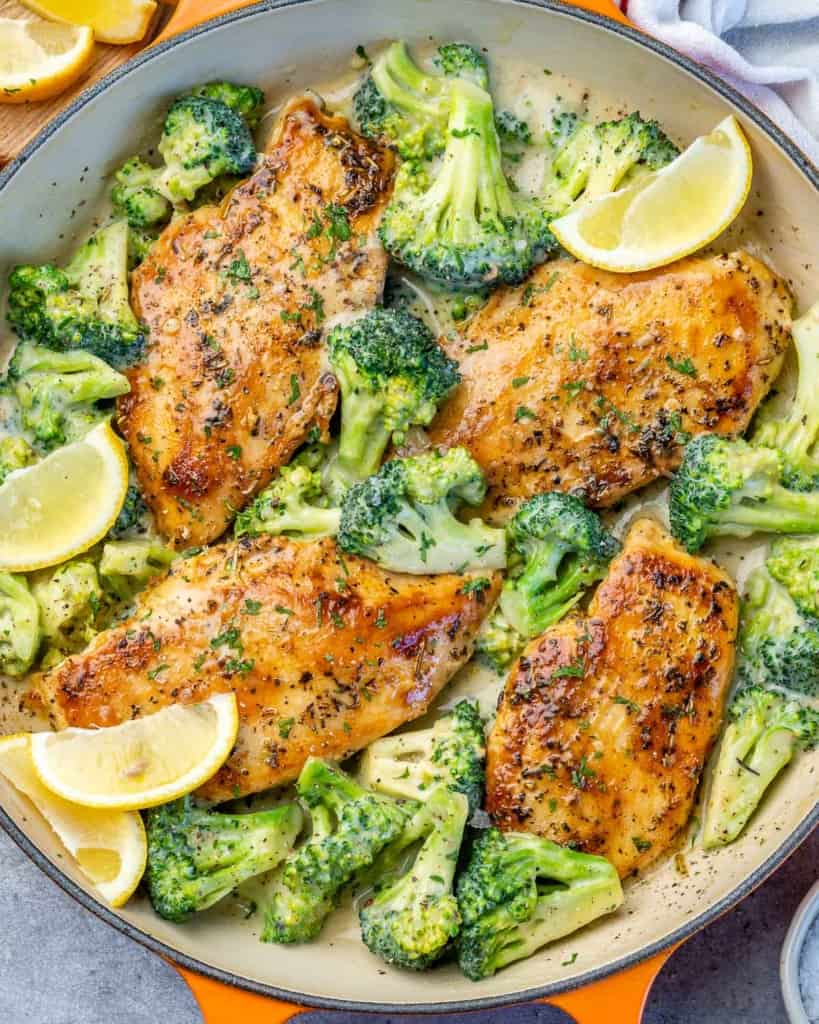 top view chicken and broccoli skillet recipe in an orange skillet