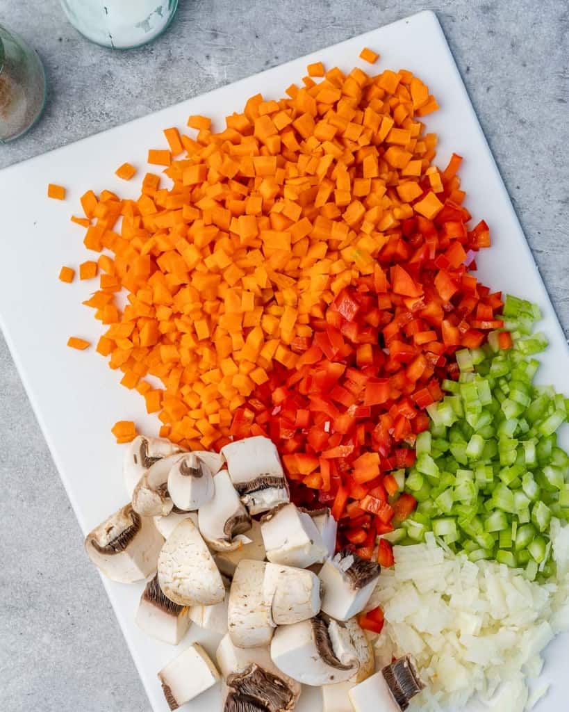 chopped veggies on a white cutting board