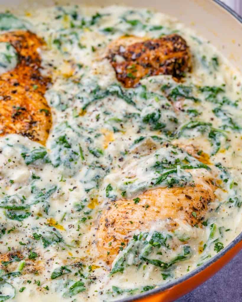 side shot of chicken in creamy spinach sauce