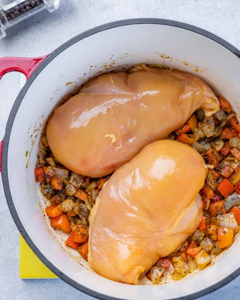 raw chicken breasts added to sauteed veggies 