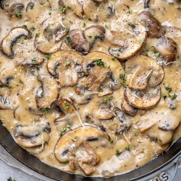 top view creamy mushroom in black skillet
