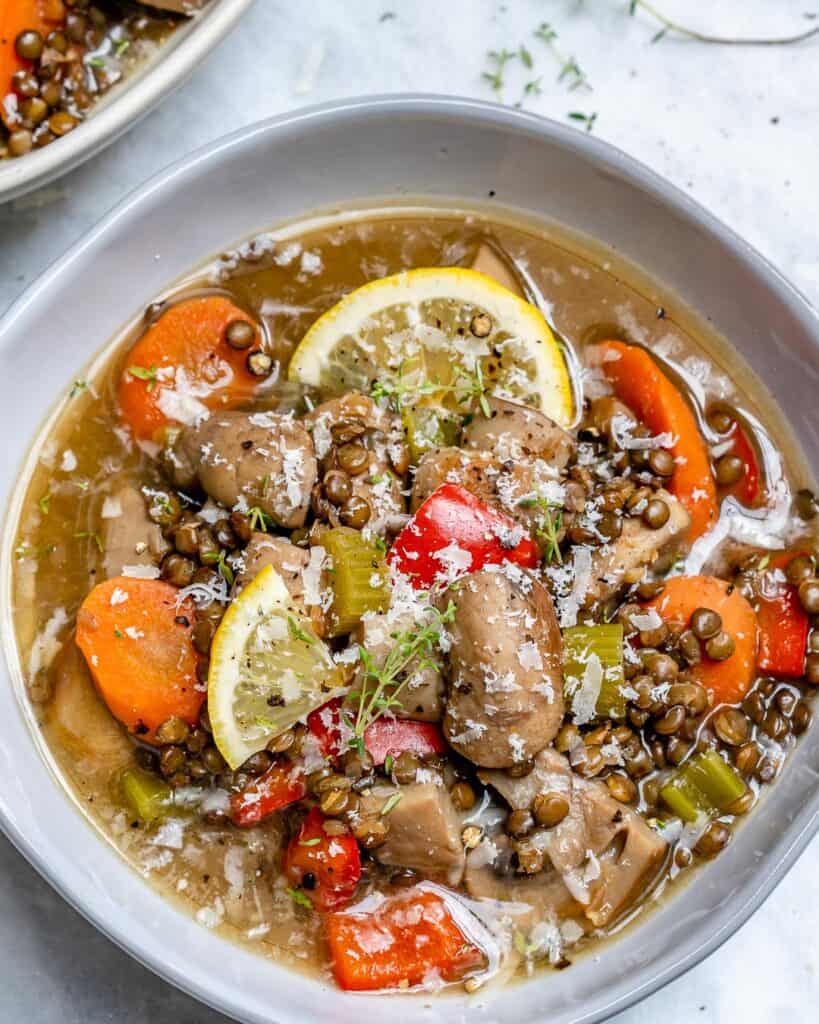 top view of mushroom soup recipe with lentil and carrots in a bowl