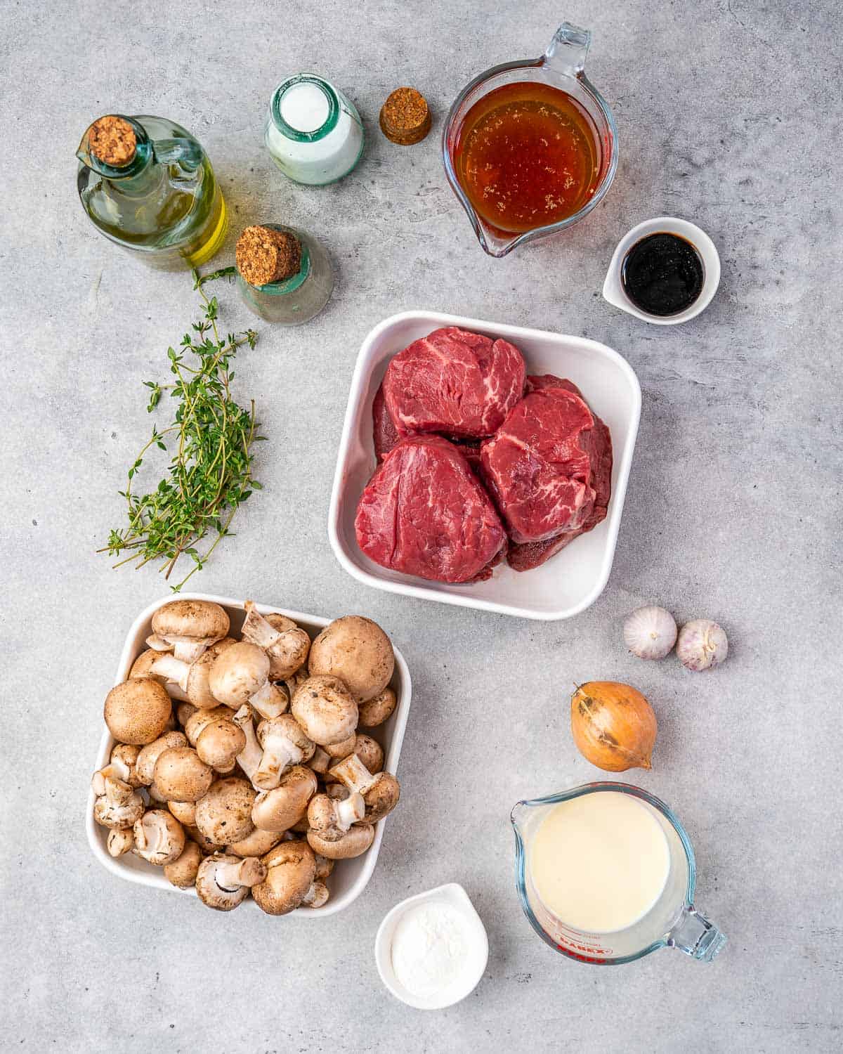 Ingredients for filet mignon and mushrooms on counter. 