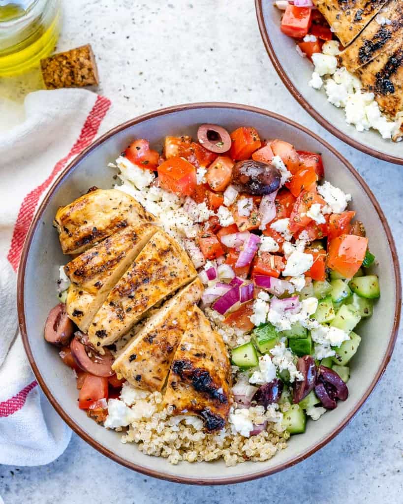 One bowl filled with chicken and vegetables with quinoa