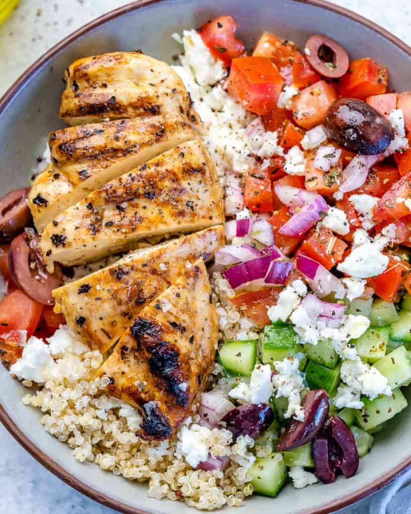 Close image of Greek chicken bowl with veggies