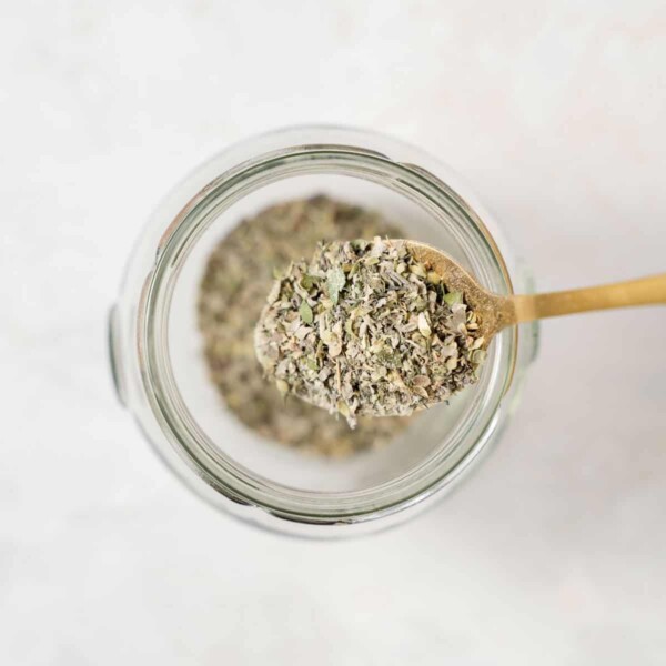 top view of spoonful of greek seasoning in a jar