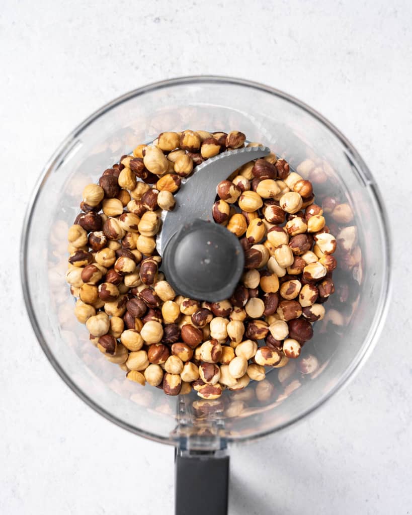 peeled hazelnuts in a food processor