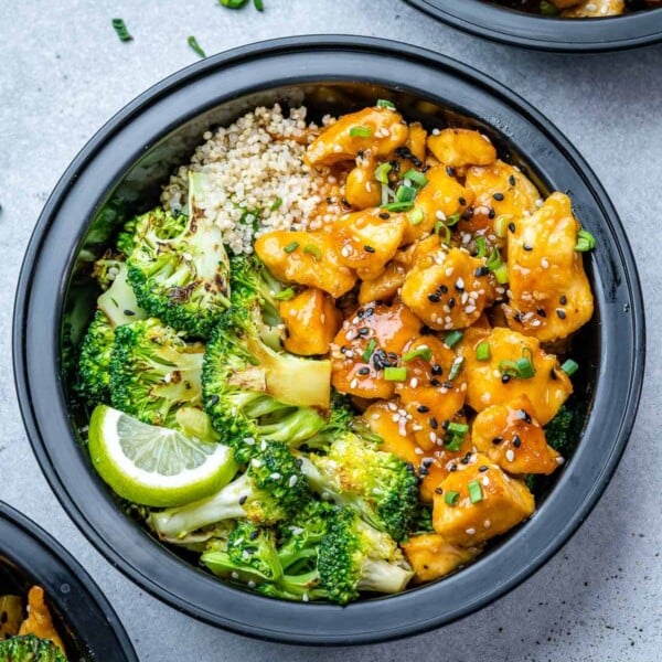 top view of honey chicken with broccoli and quinoa in a meal prep bowl.