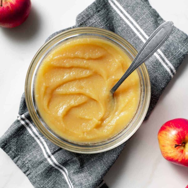 top view of apple sauce in a bowl with spoon in bowl