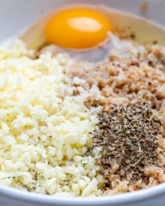 Mix cauliflower rice with egg and seasonings in a bowl.