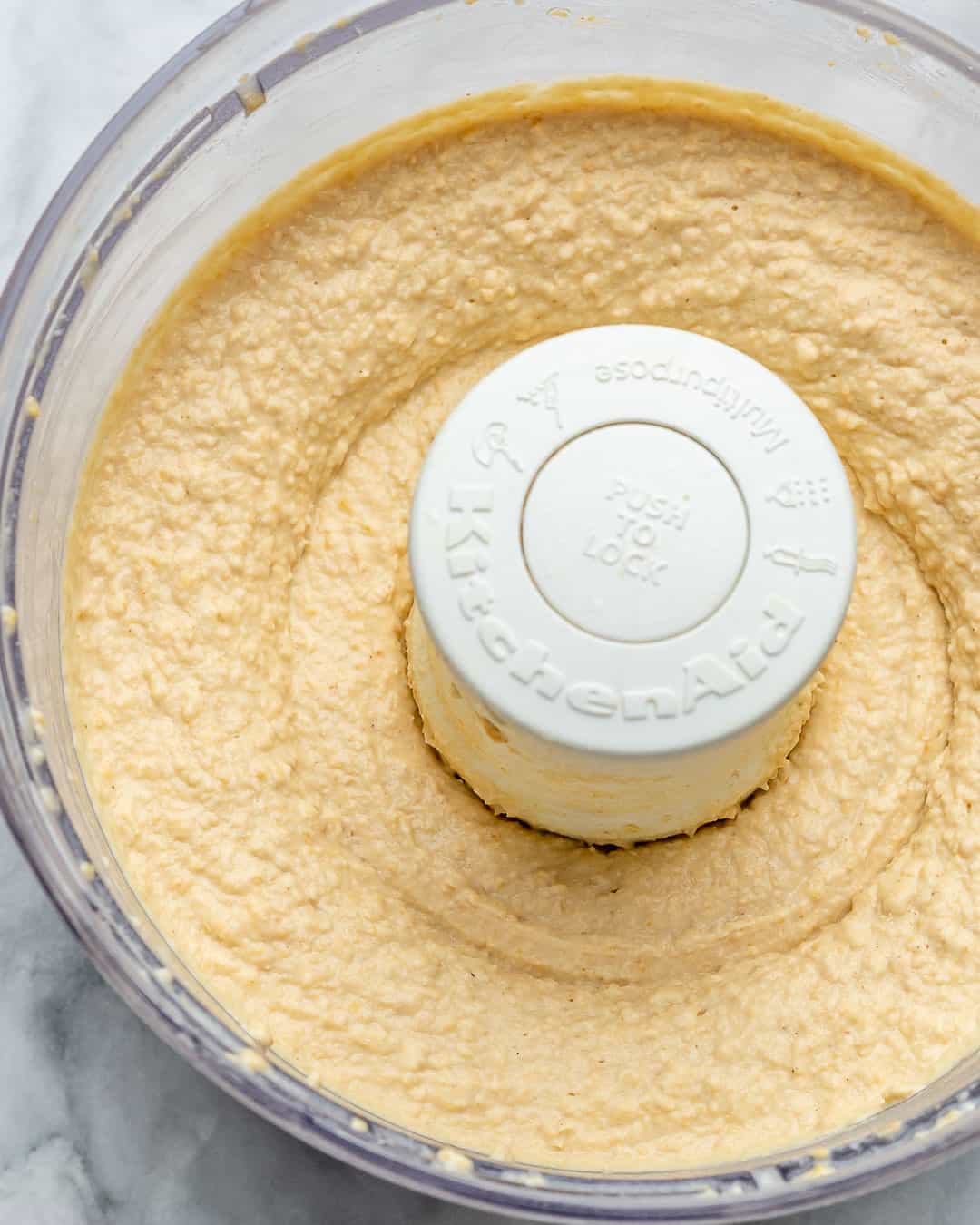 creamy blended hummus in a food processor.