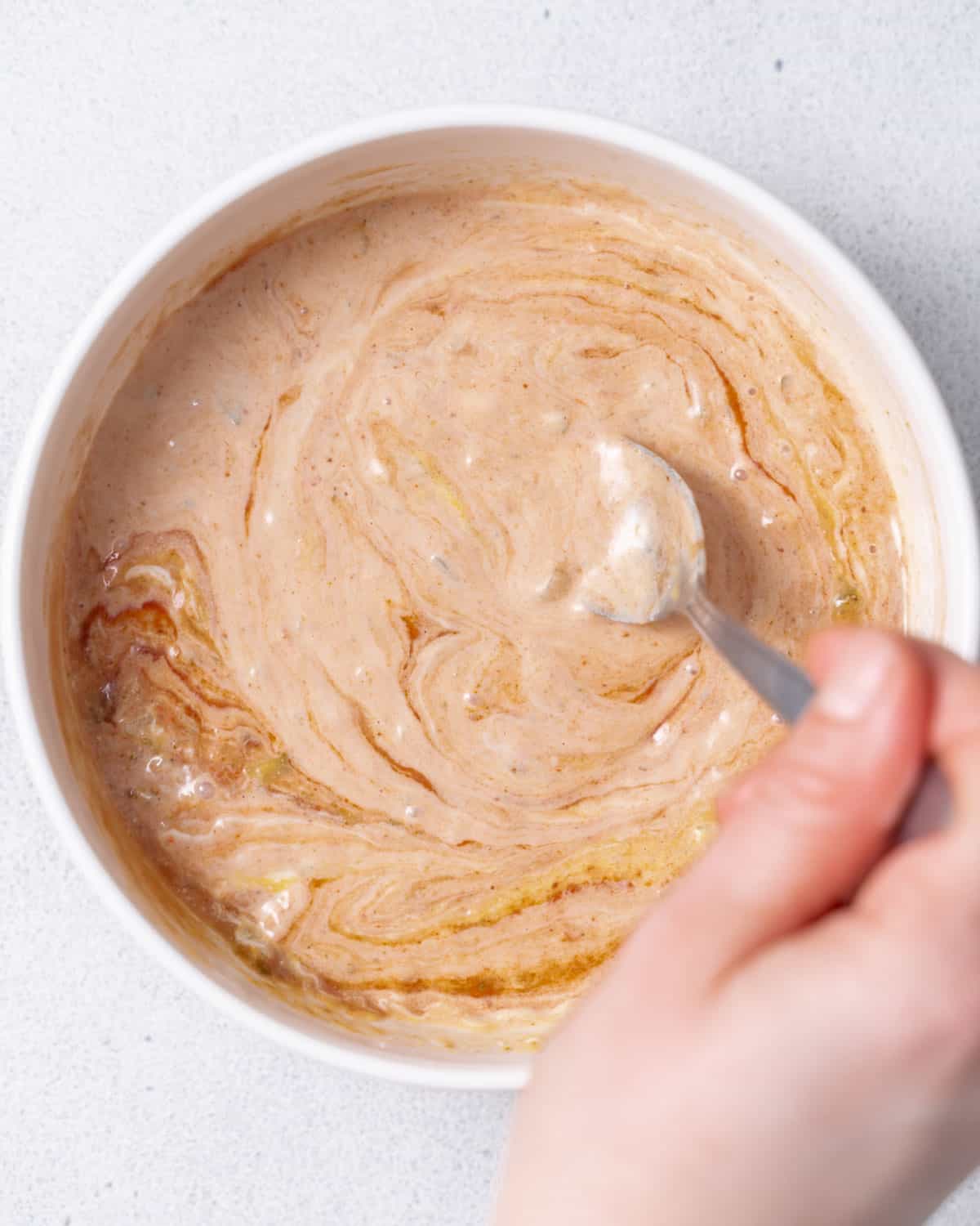 Stirring In-N-Out sauce in a bowl.