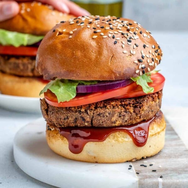 side view of a black bean vegan burger on platter