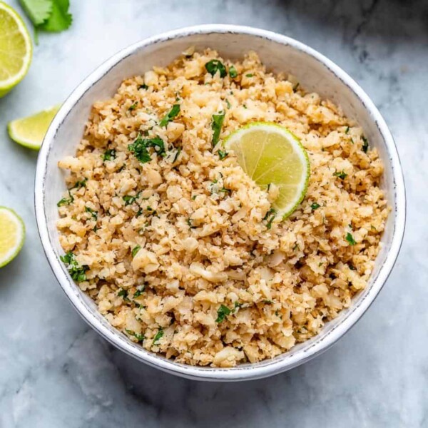 cauliflower rice in a round white bowl.