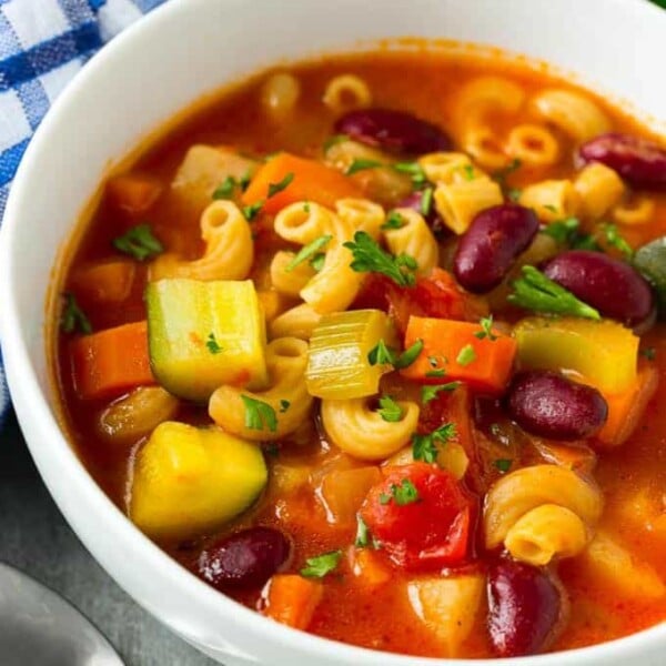 Minestrone Soup that is tomato base in a round white bowl