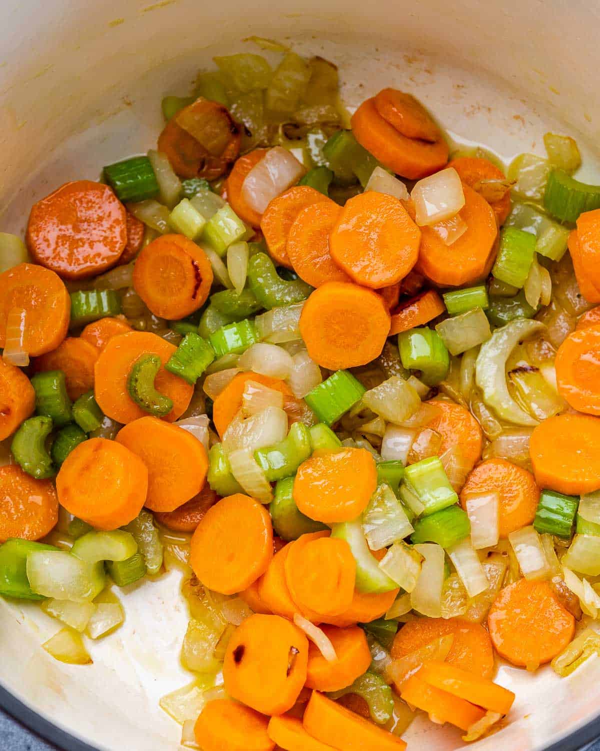 Sautéing veggies in a large pot.