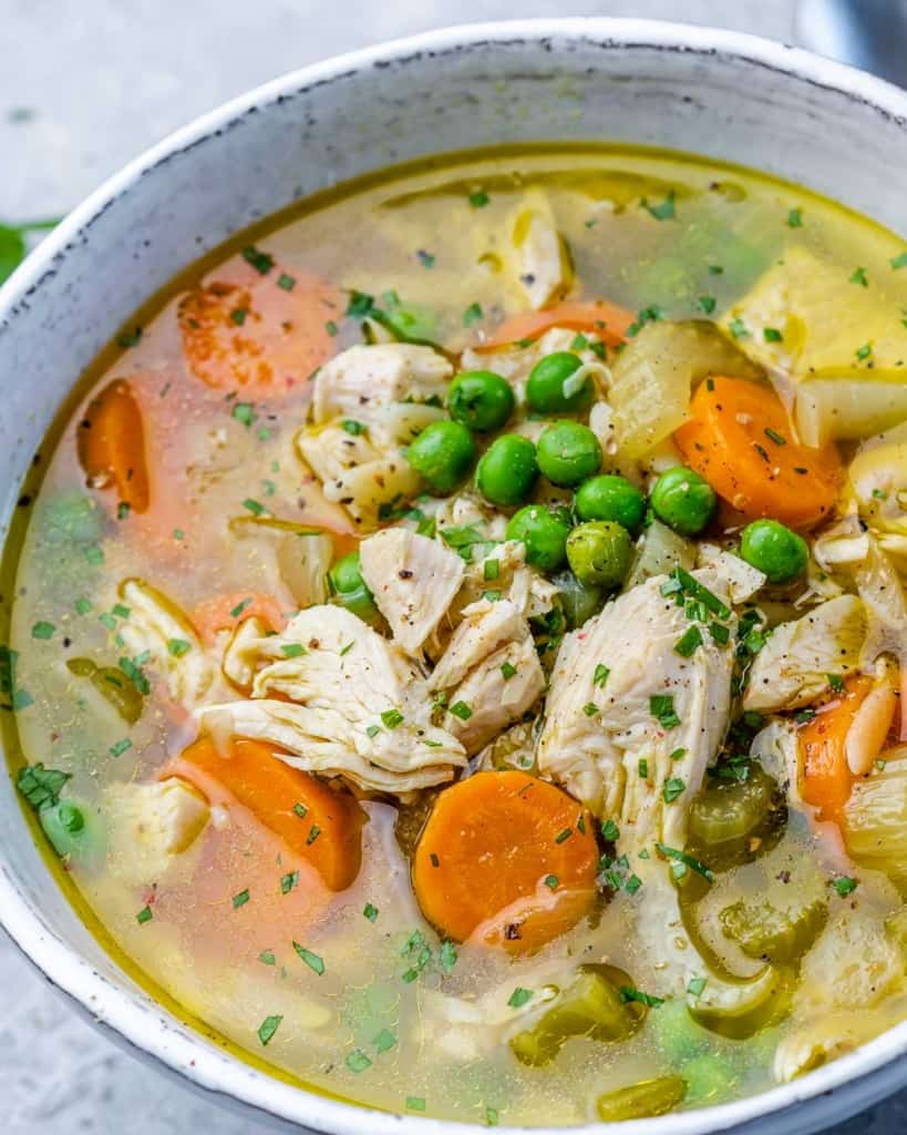 Leftover turkey soup served in a white bowl.