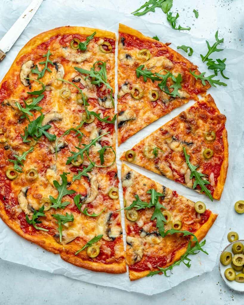 top view of whole pizza with 3 slices on the right side