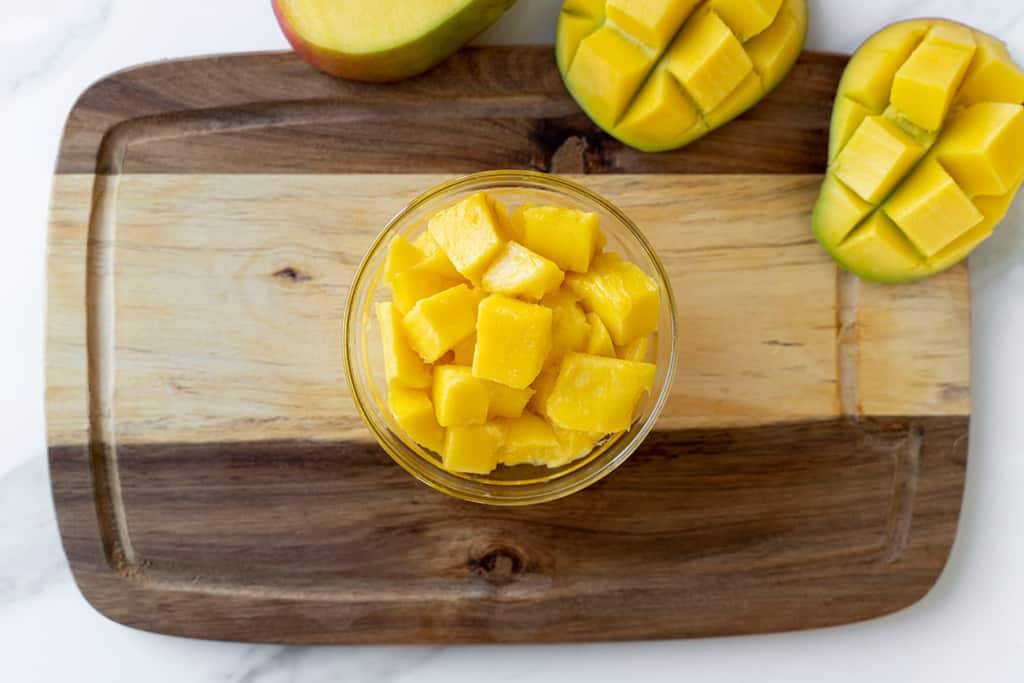 top view of chopped mango cubes in a bowl