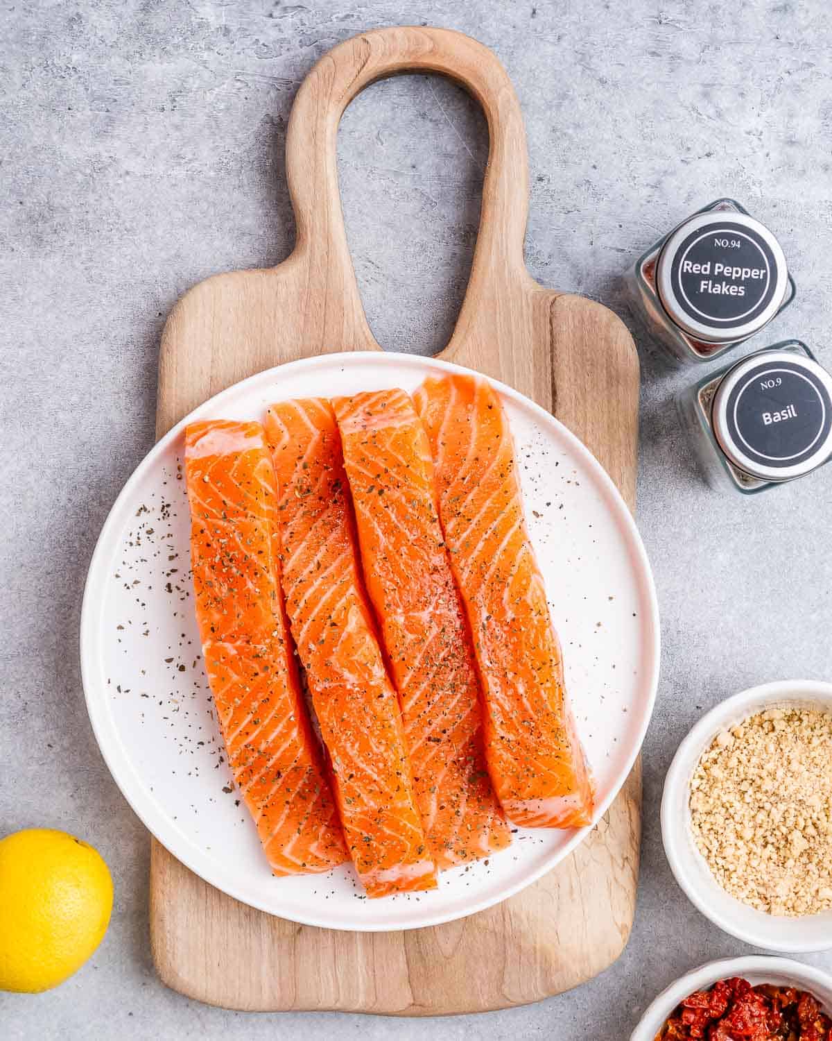 season salmon filets on a plate.