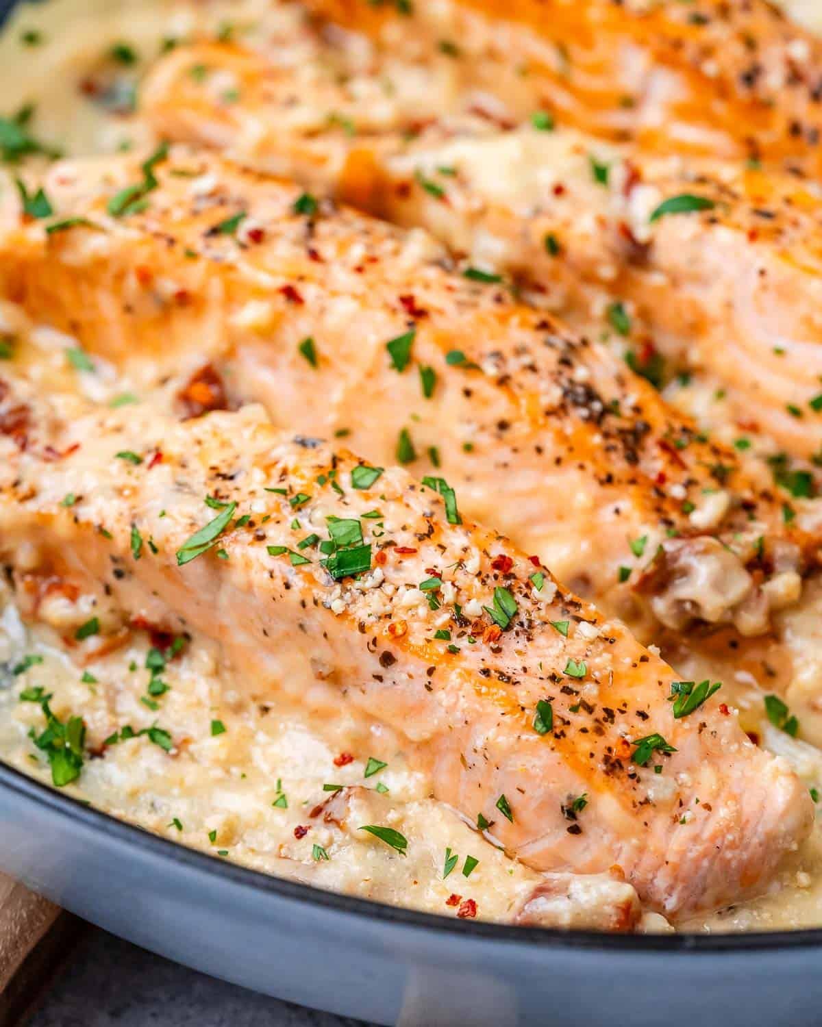 cooked salmon filets in a creamy sauce.