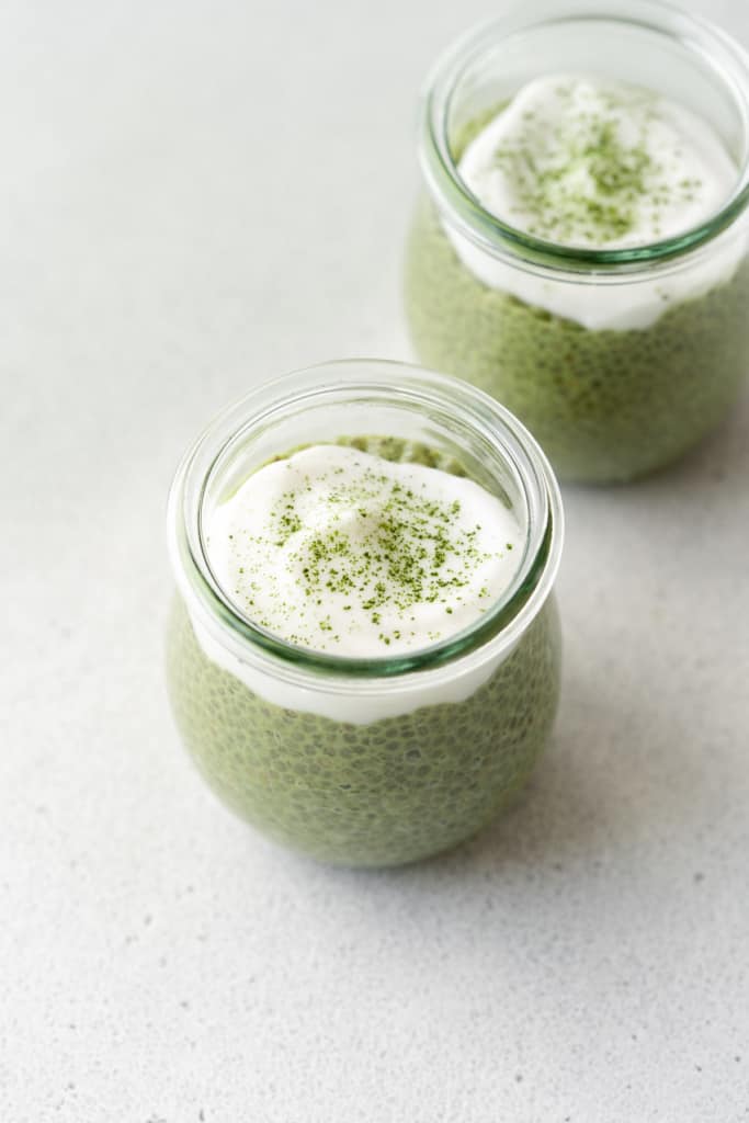 matcha powder added over the coconut whipped yogurt