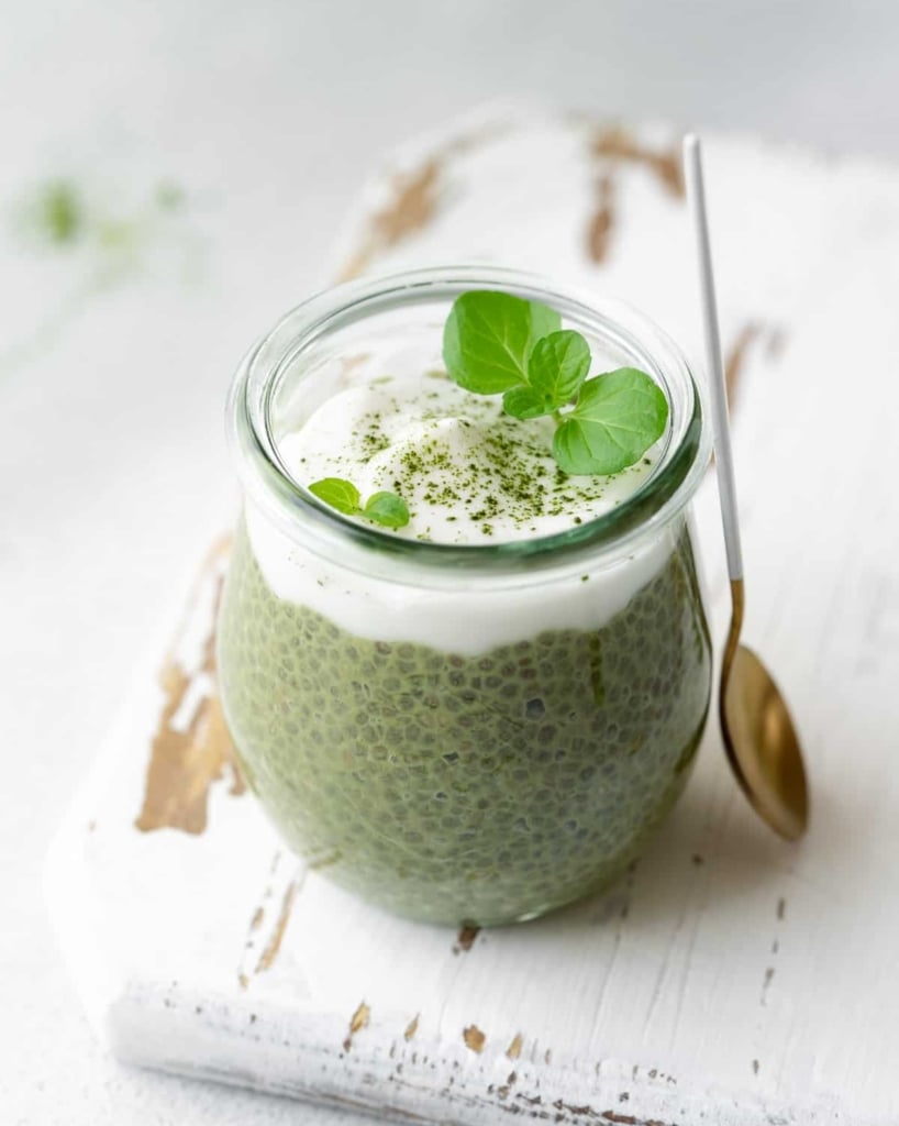 side shot of chia pudding topped with yogurt in a jar