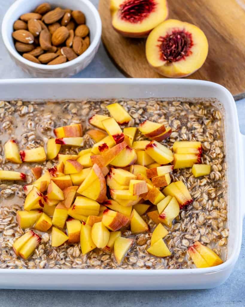 Adding diced peaches into oat mixture.