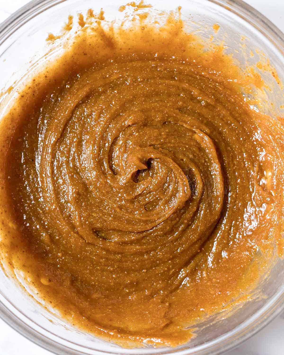 paste-like texture of peanut butter, eggs, and sugar mixed with each other.