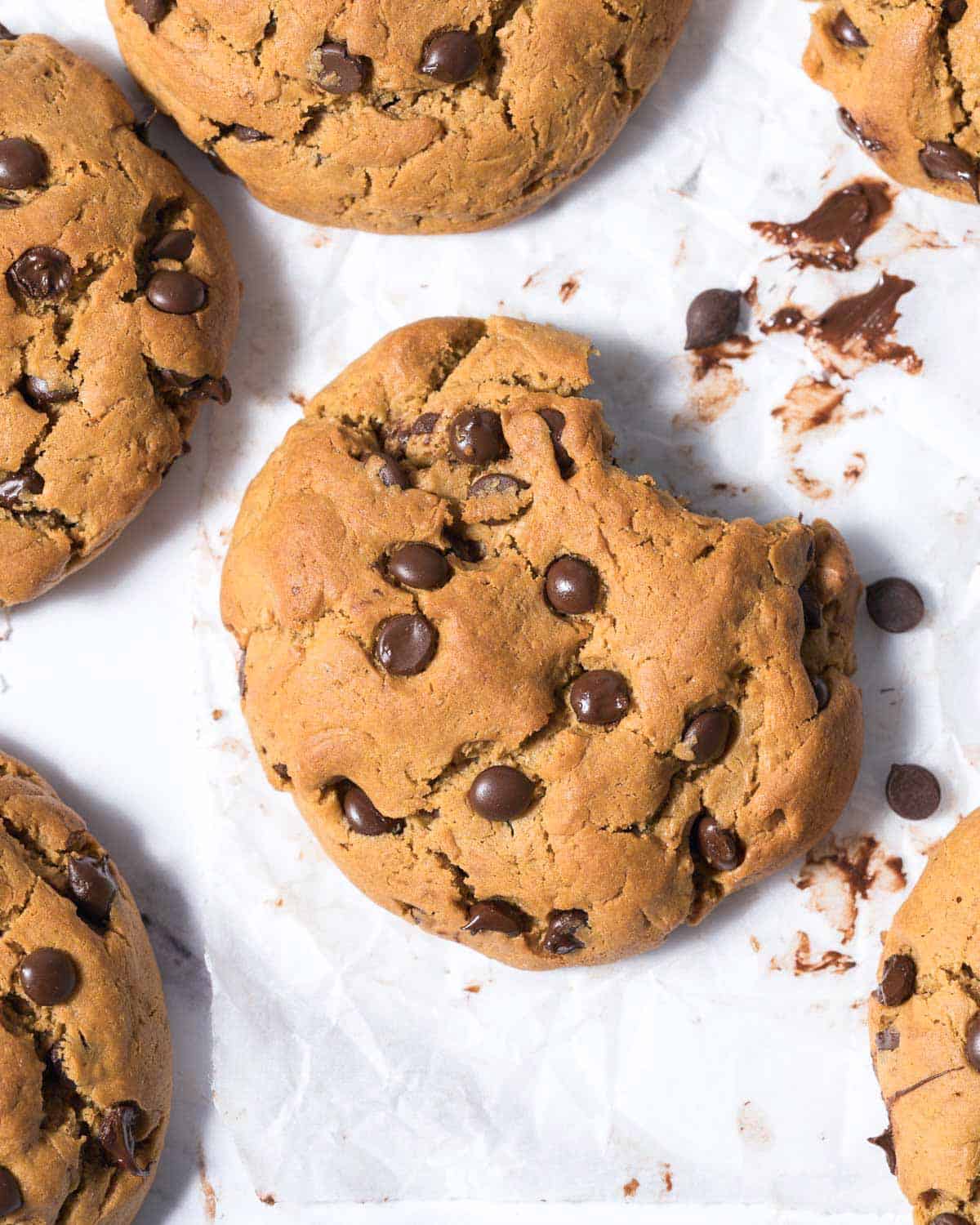 a bite taken of chocolate chip peanut butter cookies.