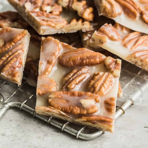 close up of pecan brittle on a wire wrack cooling