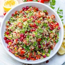 A round white bowl with tabbouleh.
