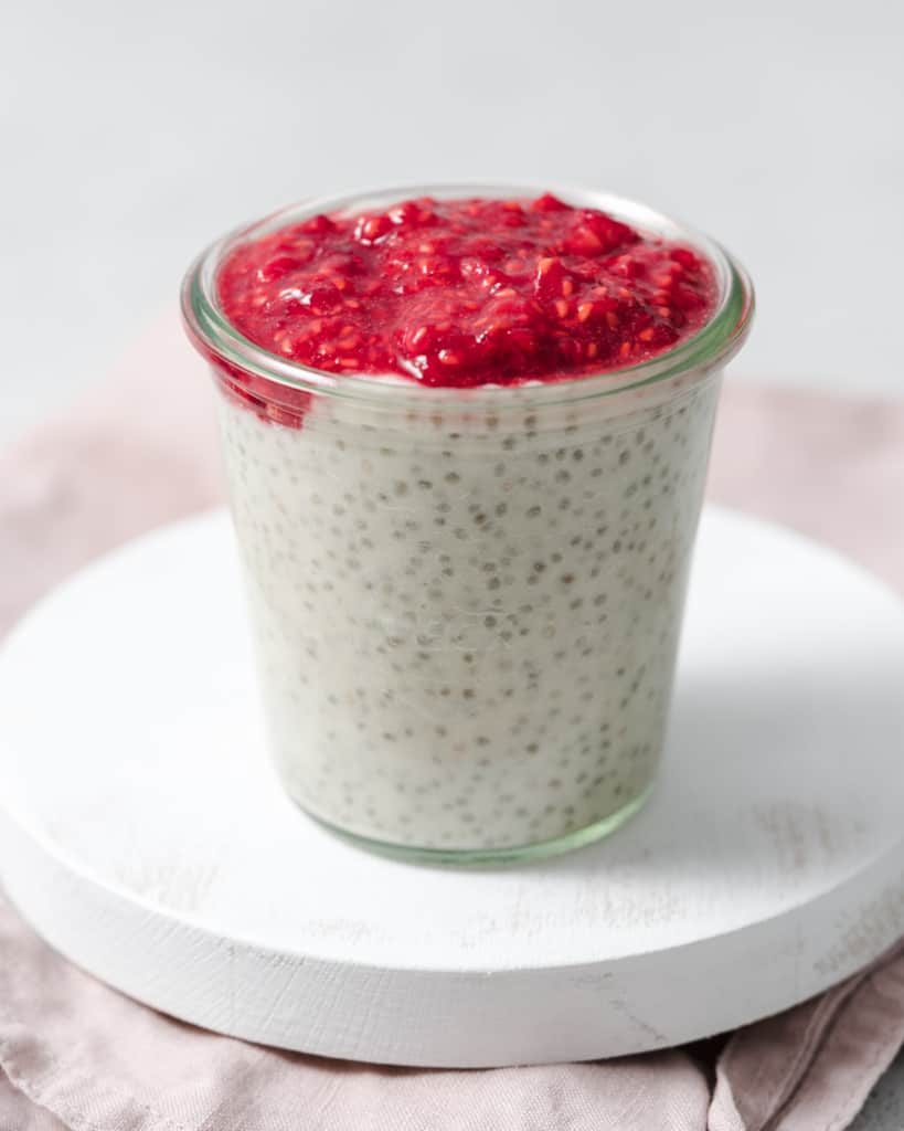 Topping chia pudding with mashed raspberries.