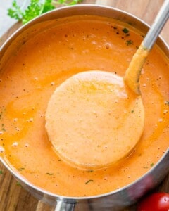 soup in a pot with a spoonful of soup being removed from the pot.