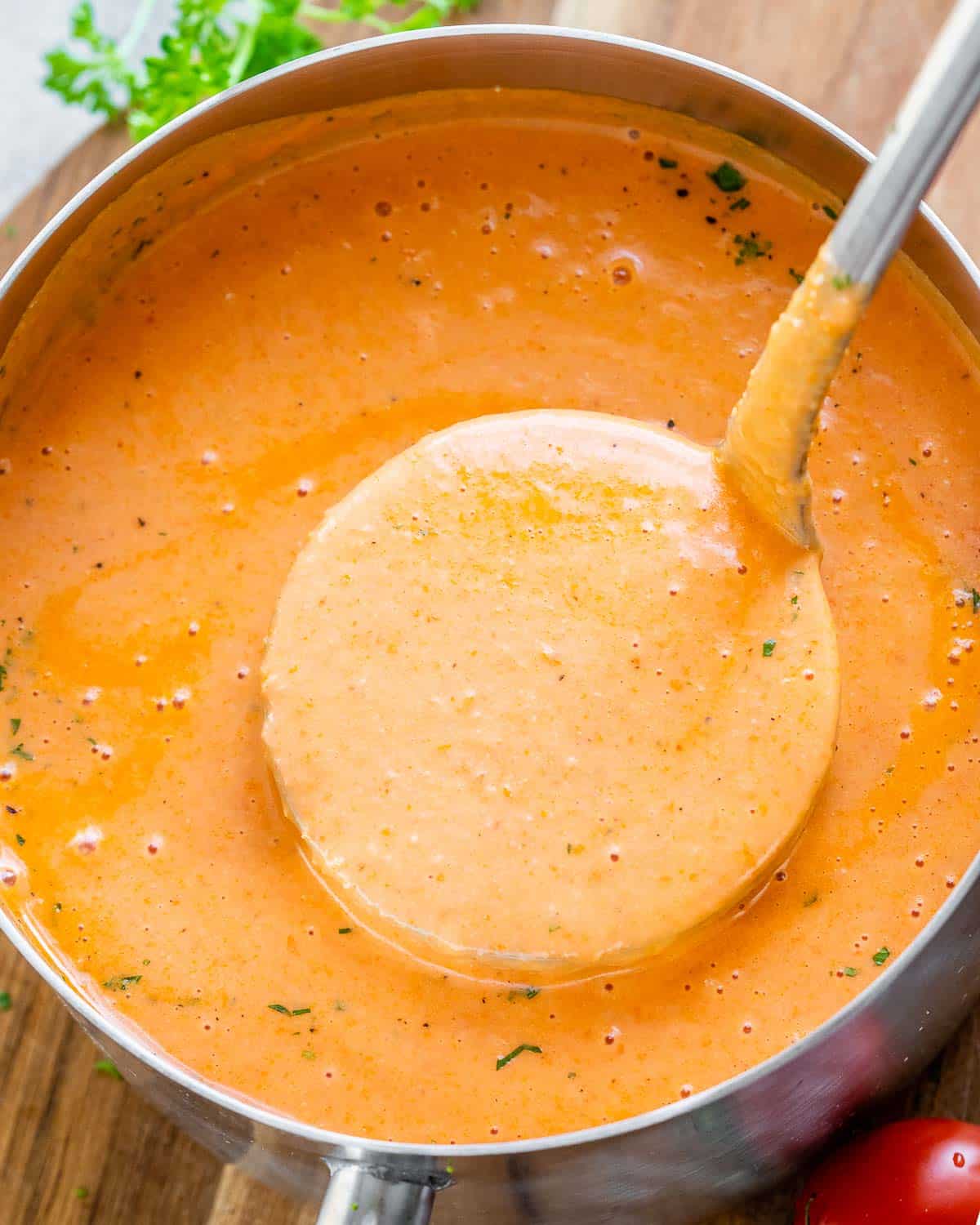 soup in a pot with a spoonful of soup being removed from the pot.