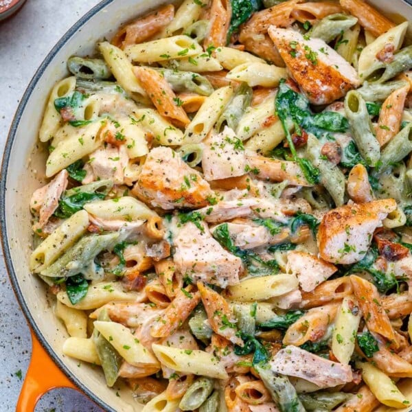 top view salmon pasta in an orange skillet