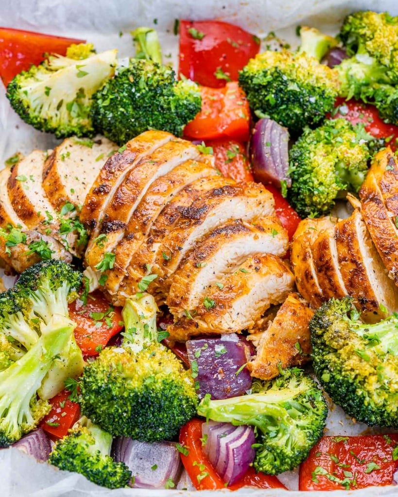 side shot of sliced chicken breast with roasted veggies 