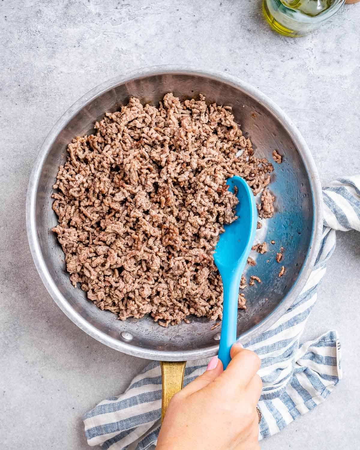 Browning beef in a skillet.